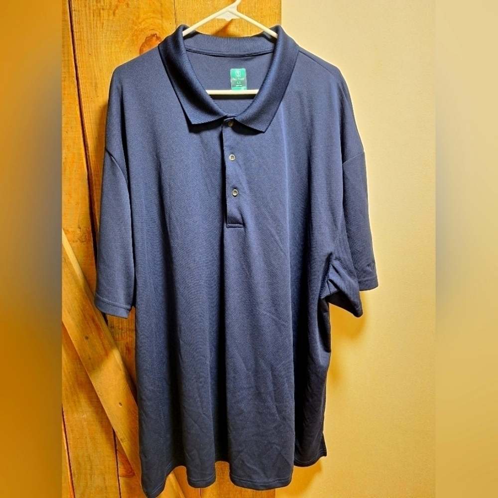 A Ping navy blue Golf polo in a mens size 4XL. EUC.
